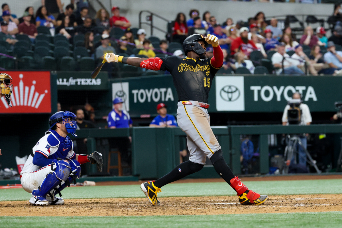 Apr 22, 2026; Arlington, Texas, USA; Pittsburgh Pirates center fielder Oneil Cruz (15) hits a three-run home run during the ninth inning against the Texas Rangers at Globe Life Field. Mandatory Credit: Kevin Jairaj-Imagn Images