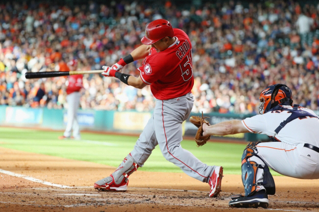 i-Man Choi #51 of the Los Angeles Angels of Anaheim swings at a pitch in the second inning of their game against the Houston Astros at Minute Maid Park on July 23, 2016 in Houston, Texas. Scott Halleran/Getty Images/AFP== FOR NEWSPAPERS, INTERNET, TELCOS & TELEVISION USE ONLY ==
