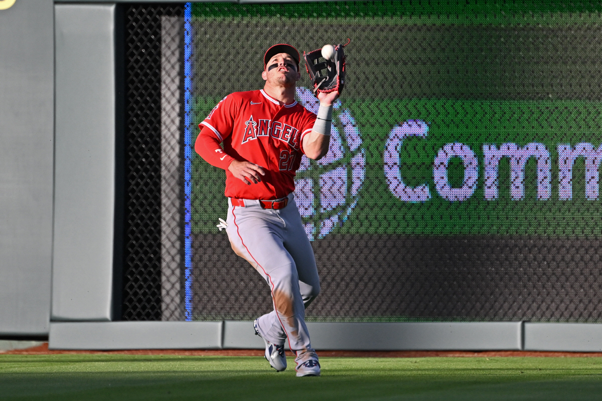 Apr 24, 2026; Kansas City, Missouri, USA; Los Angeles Angels center fielder Mike Trout (27) catches a fly ball in the first inning against the Kansas City Royals at Kauffman Stadium. Mandatory Credit: Peter Aiken-Imagn Images
