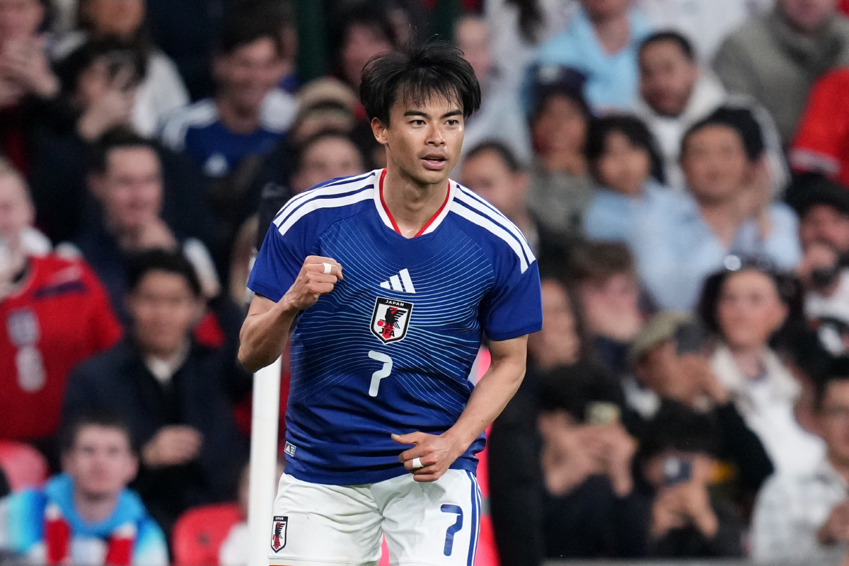 Japan's Kaoru Mitoma celebrates after scoring his side's first goal during the International friendly soccer match between England and Japan in London, Tuesday, March 31, 2026 . (AP Photo/Kirsty Wigglesworth)