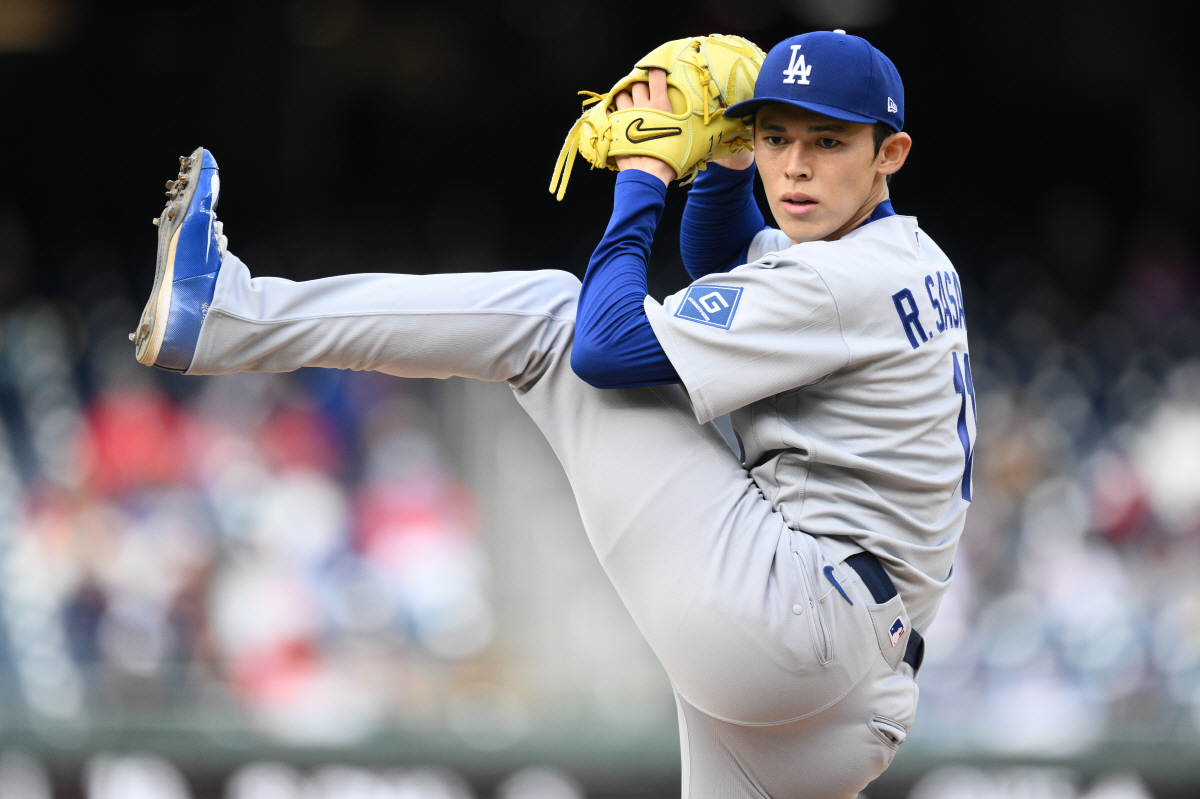 Los Angeles Dodgers starting pitcher Roki Sasaki (11) throws during the fifth inning of a baseball game against the Washington Nationals, Sunday, April 5, 2026, in Washington. (AP Photo/Nick Wass)