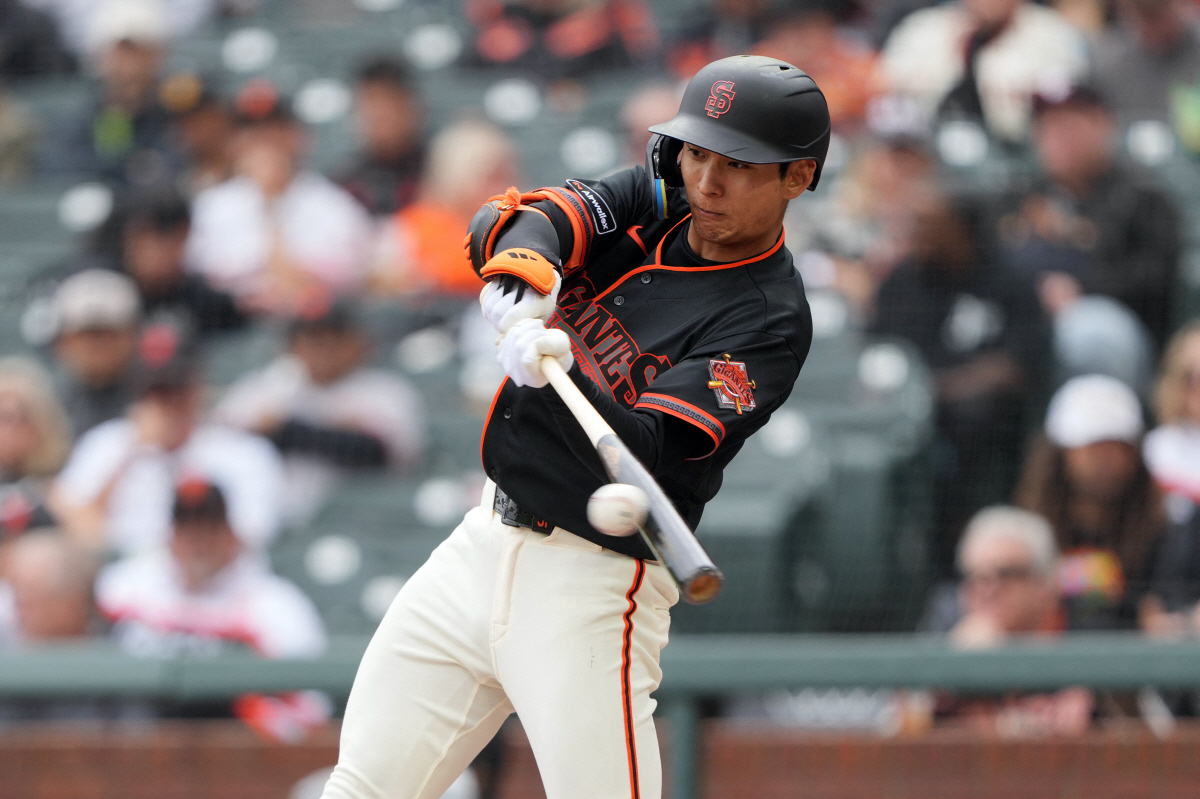 Apr 25, 2026; San Francisco, California, USA; San Francisco Giants right fielder Jung Hoo Lee (51) hits a double against the Miami Marlins during the fourth inning at Oracle Park. Mandatory Credit: Darren Yamashita-Imagn Images