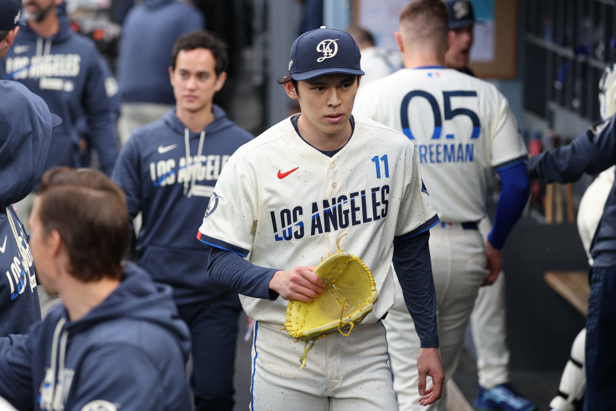 Apr 25, 2026; Los Angeles, California, USA; Los Angeles Dodgers starting pitcher Roki Sasaki (11) walks in the dugout after the first inning against the Chicago Cubs at Dodger Stadium. Mandatory Credit: Kiyoshi Mio-Imagn Images