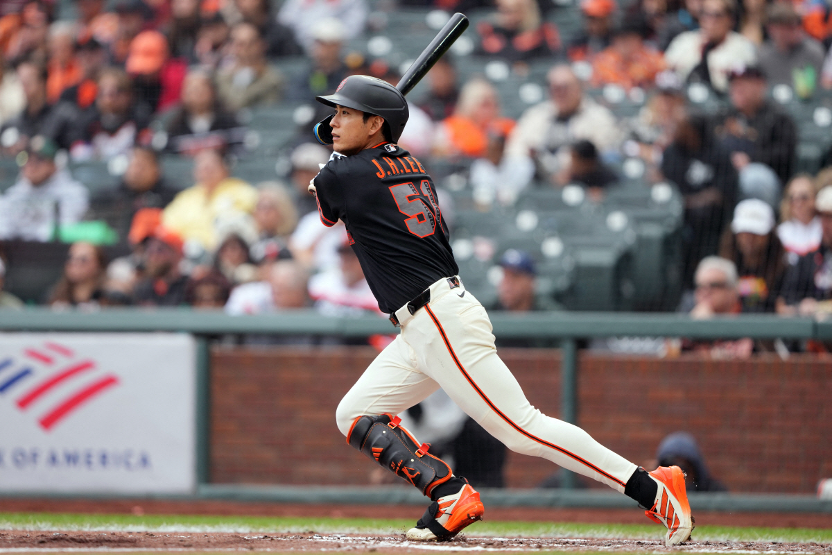 Apr 25, 2026; San Francisco, California, USA; San Francisco Giants right fielder Jung Hoo Lee (51) hits a double against the Miami Marlins during the fourth inning at Oracle Park. Mandatory Credit: Darren Yamashita-Imagn Images