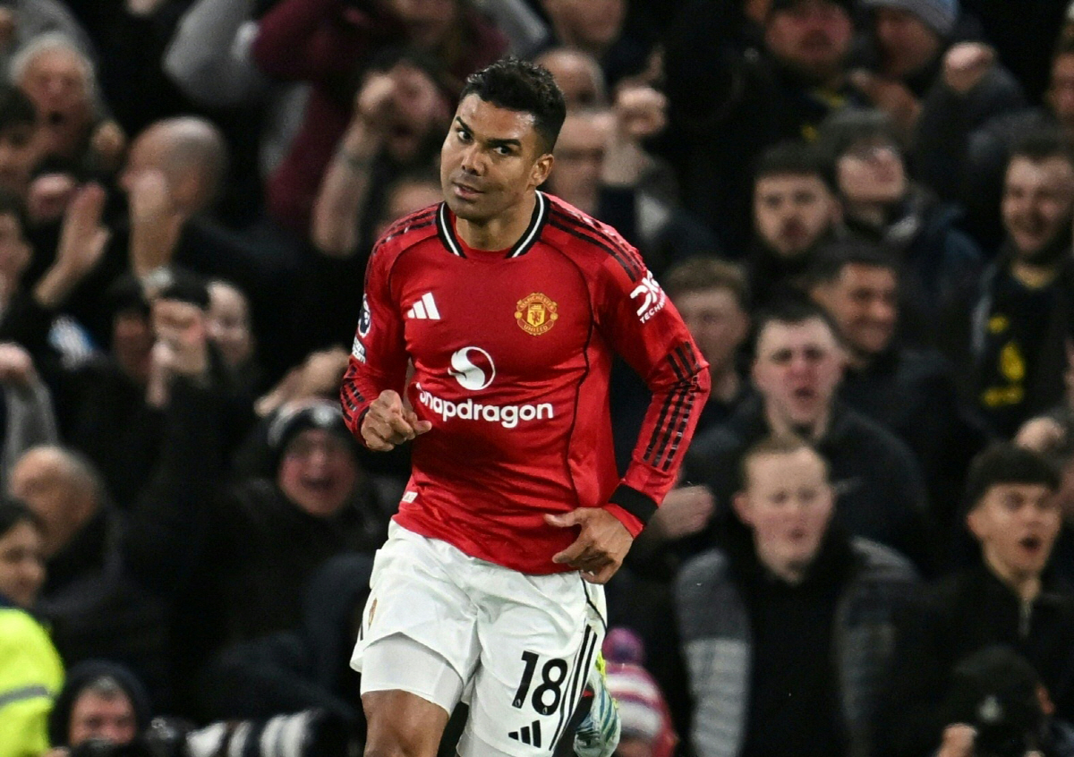 Manchester United's Brazilian midfielder #18 Casemiro celebrates after scoring their first goal during the English Premier League football match between Manchester United and Leeds United at Old Trafford in Manchester, north west England, on April 13, 2026. (Photo by Paul ELLIS / AFP) / RESTRICTED TO EDITORIAL USE. No use with unauthorized audio, video, data, fixture lists, club/league logos or 'live' services. Online in-match use limited to 120 images. An additional 40 images may be used in extra time. No video emulation. Social media in-match use limited to 120 images. An additional 40 images may be used in extra time. No use in betting publications, games or single club/league/player publications. /
