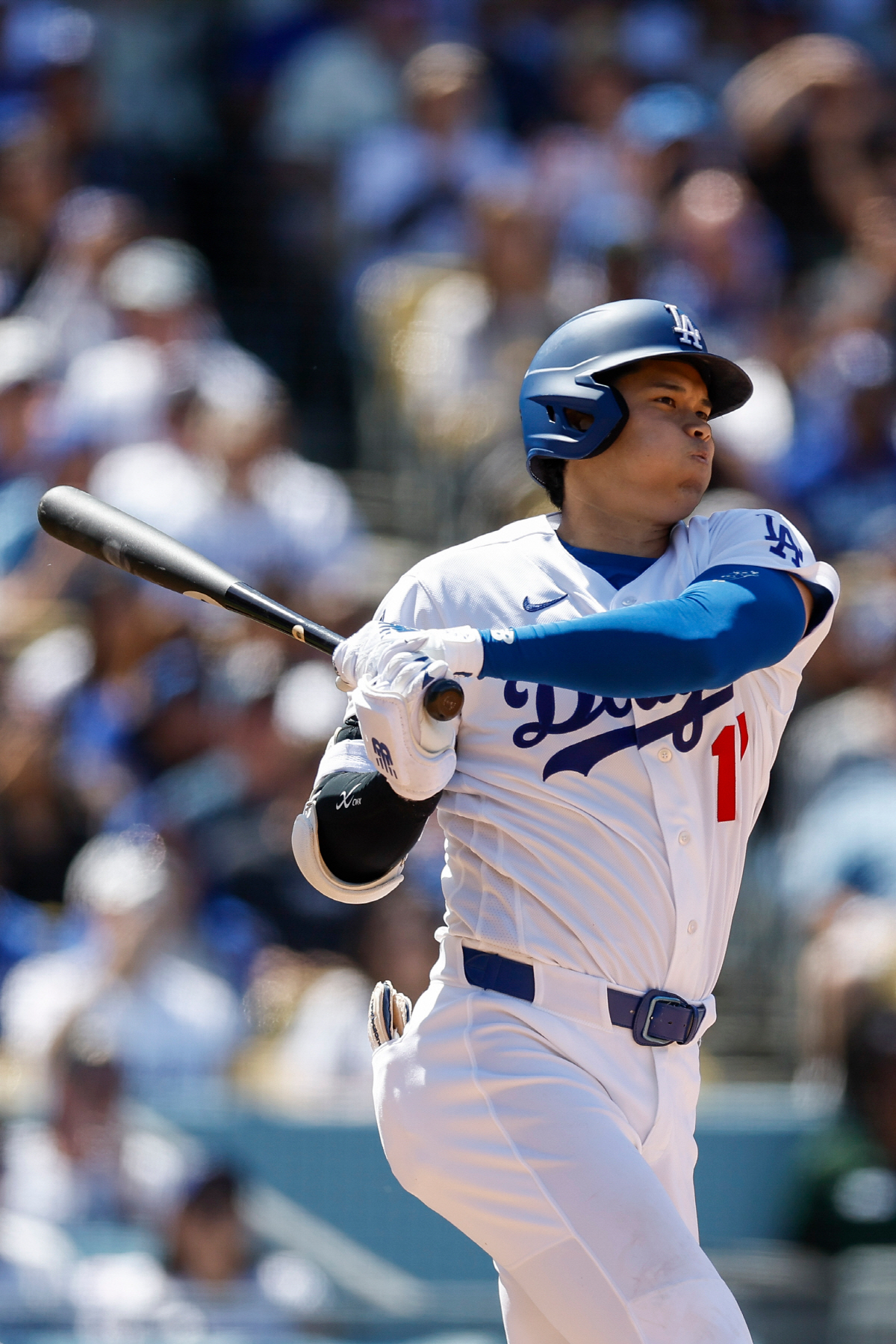 Los Angeles Dodgers designated hitter Shohei Ohtani hits a double during the fifth inning of a baseball game against the Chicago Cubs, Sunday, April 26, 2026, in Los Angeles. (AP Photo/Caroline Brehman)