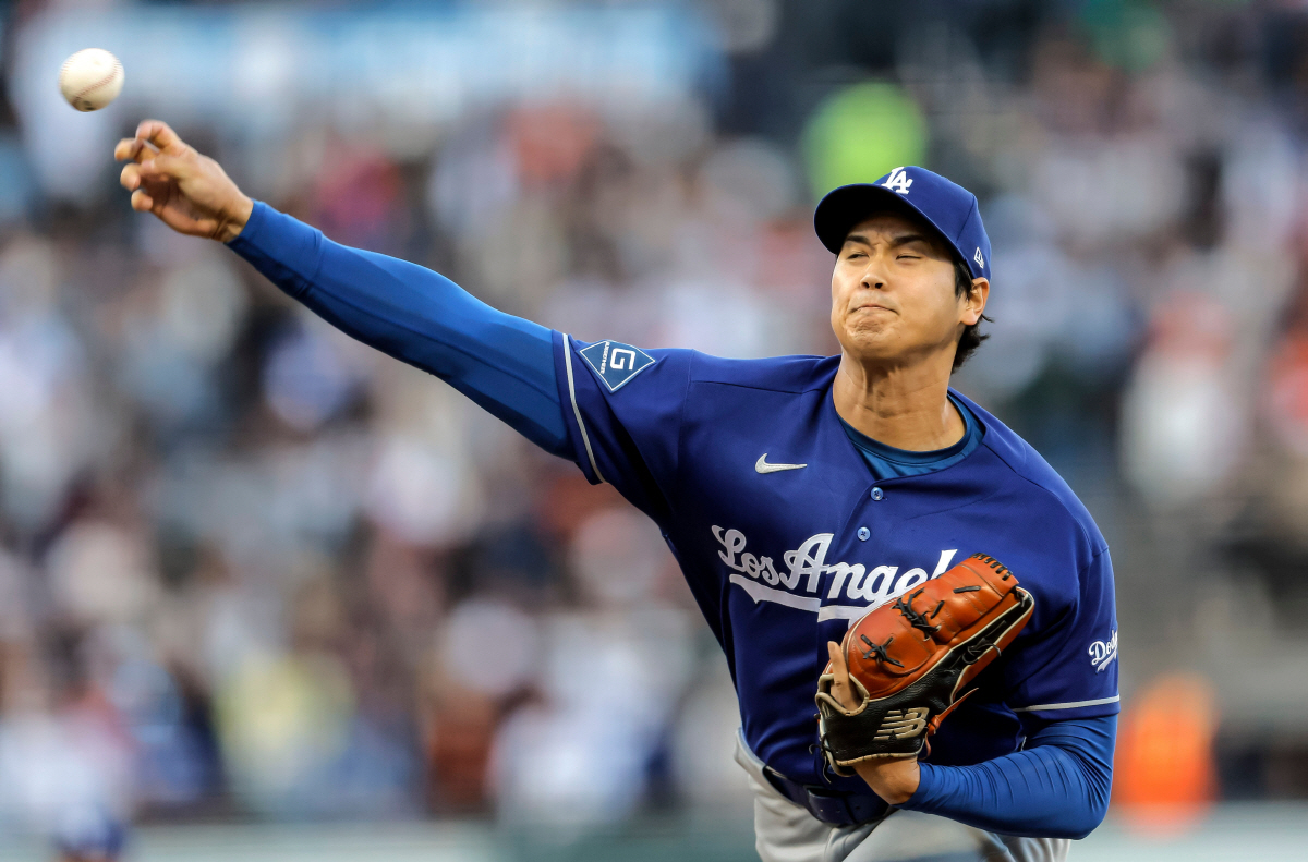 Los Angeles Dodgers pitcher Shohei Ohtani throws in the first inning against the San Francisco Giants in a baseball game Wednesday, April 22, 2026, in San Francisco. (Carlos Avila Gonzalez/San Francisco Chronicle via AP) MANDATORY CREDIT: PHOTOGRAPHER AND SAN FRANCISCO CHRONICLE; SAN JOSE MERCURY NEWS OUT; EAST BAY TIMES OUT; MARIN INDEPENDENT JOURNAL OUT; SAN FRANCISCO EXAMINER OUT