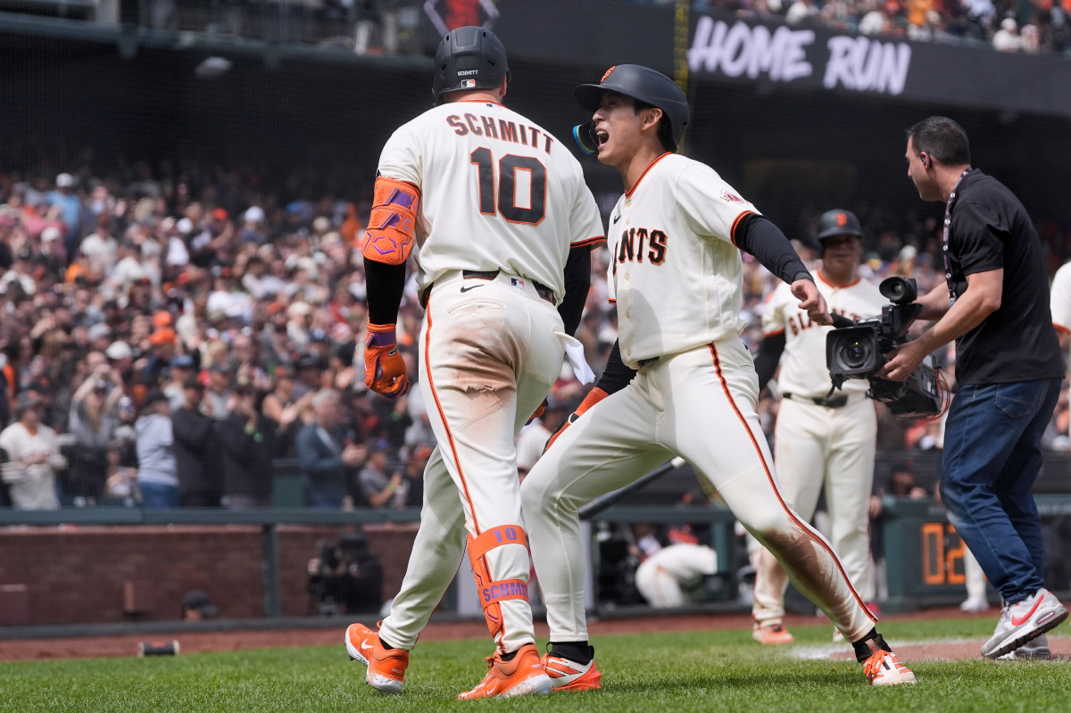 San Francisco Giants' Casey Schmitt (10) celebrates after hitting a three-run home run that also scored Jung Hoo Lee, middle right, and Matt Chapman during the seventh inning of a baseball game against the Miami Marlins Sunday, April 26, 2026, in San Francisco. (AP Photo/Jeff Chiu)