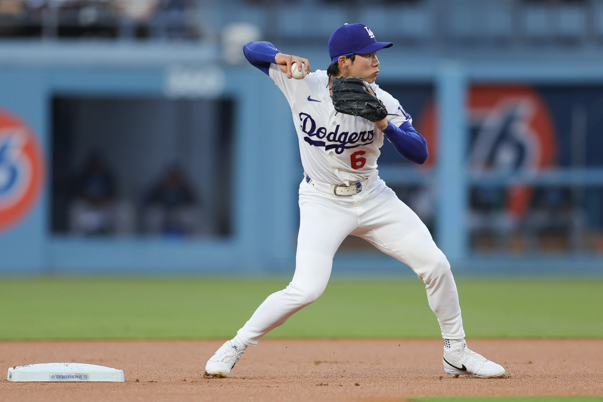 Los Angeles Dodgers shortstop Hyeseong Kim throws out Miami Marlins' Kyle Stowers at first base to complete a double play during the first inning of a baseball game Monday, April 27, 2026, in Los Angeles. (AP Photo/Ryan Sun)