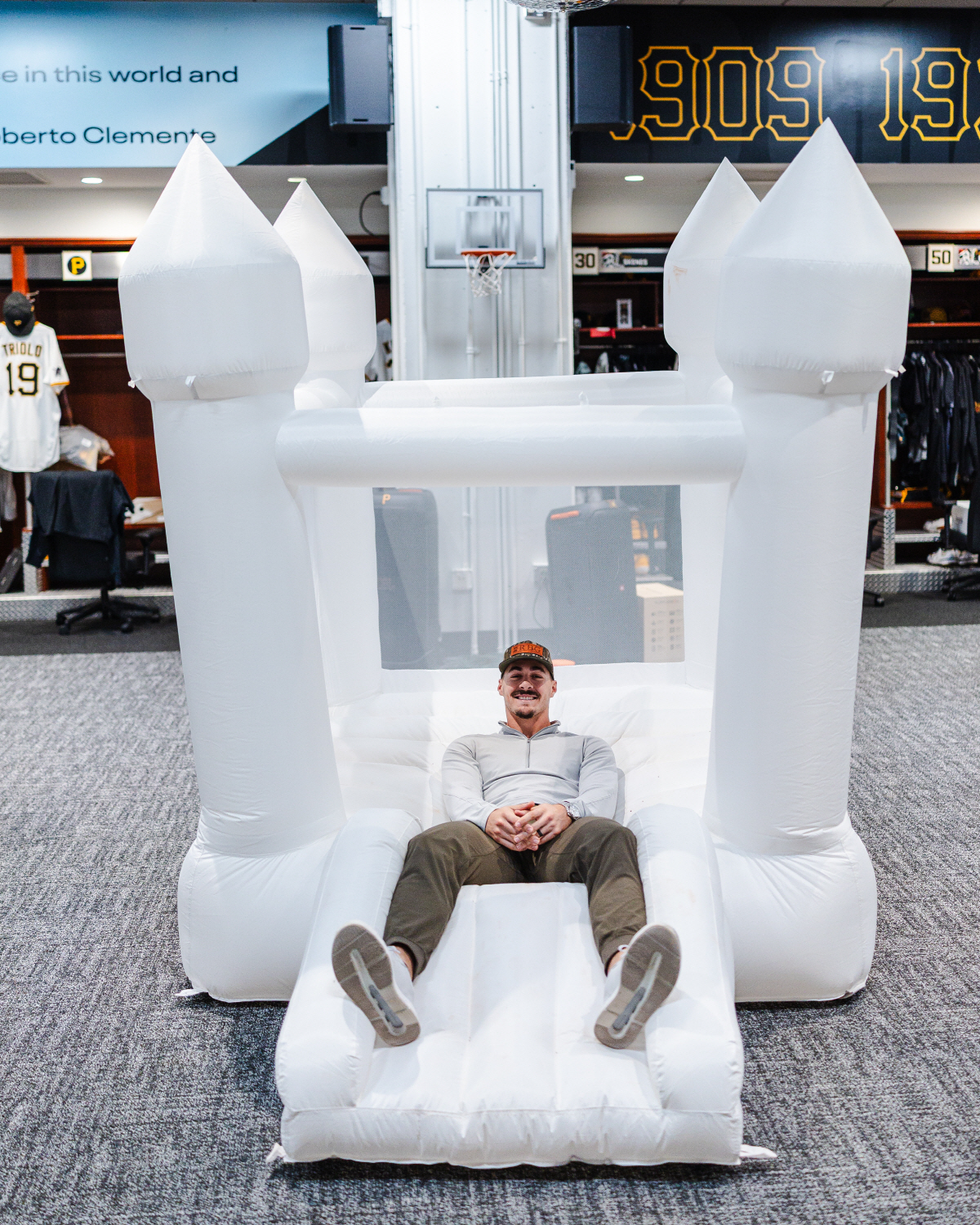 Pittsburgh Pirates rookie Konnor Griffin sits on a bounce house in the clubhouse that was rented by teammate Paul Skenes to celebrate Griffin's 20th birthday on Monday, April 27, 2026, at PNC Park in Pittsburgh. (Harrison Barden/Pittsburgh Pirates via AP) AP PROVIDES ACCESS TO THIS HANDOUT PHOTO TO BE USED SOLELY TO ILLUSTRATE NEWS REPORTING OR COMMENTARY ON THE FACTS OR EVENTS DEPICTED IN THIS IMAGE. THIS IMAGE MAY ONLY BE USED FOR 14 DAYS FROM TIME OF TRANSMISSION; NO ARCHIVING; NO LICENSING.