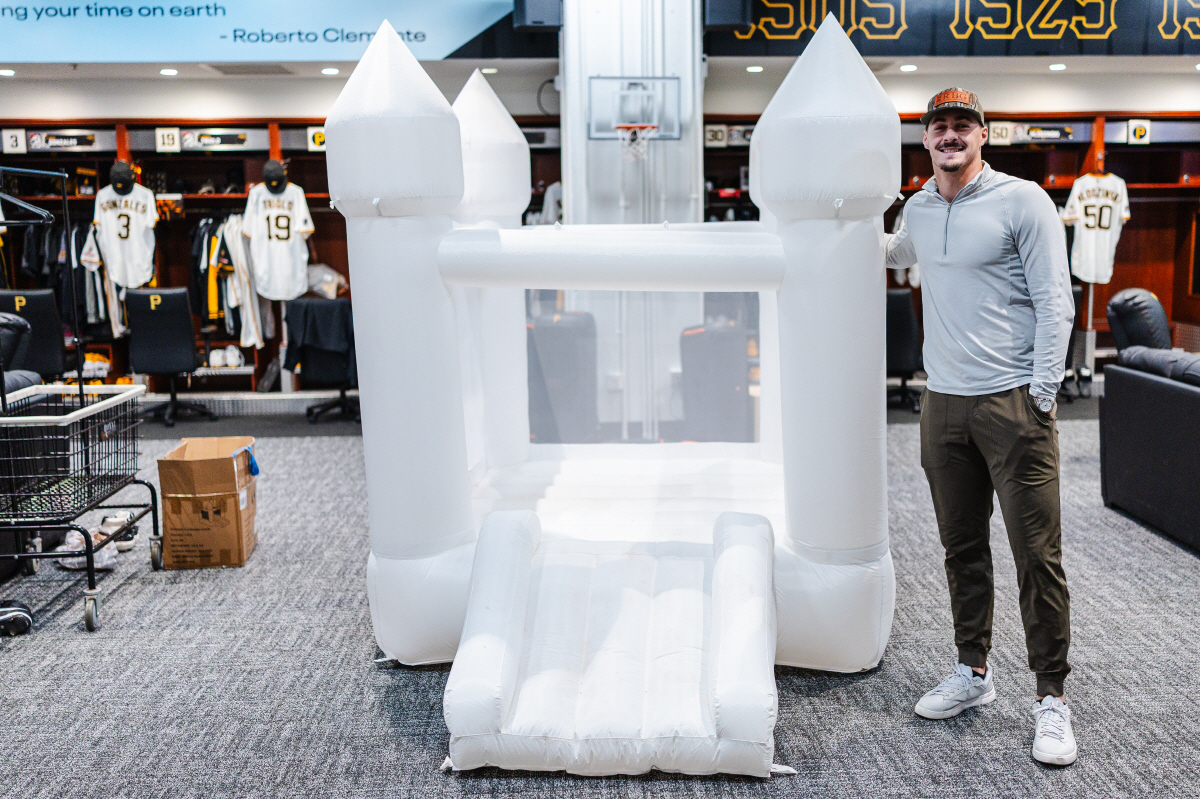 Pittsburgh Pirates rookie Konnor Griffin poses for a photo standing next to a bounce house in the clubhouse that was rented by teammate Paul Skenes to celebrate Griffin's 20th birthday on Monday, April 27, 2026, at PNC Park in Pittsburgh. (Harrison Barden/Pittsburgh Pirates via AP) AP PROVIDES ACCESS TO THIS HANDOUT PHOTO TO BE USED SOLELY TO ILLUSTRATE NEWS REPORTING OR COMMENTARY ON THE FACTS OR EVENTS DEPICTED IN THIS IMAGE. THIS IMAGE MAY ONLY BE USED FOR 14 DAYS FROM TIME OF TRANSMISSION; NO ARCHIVING; NO LICENSING.
