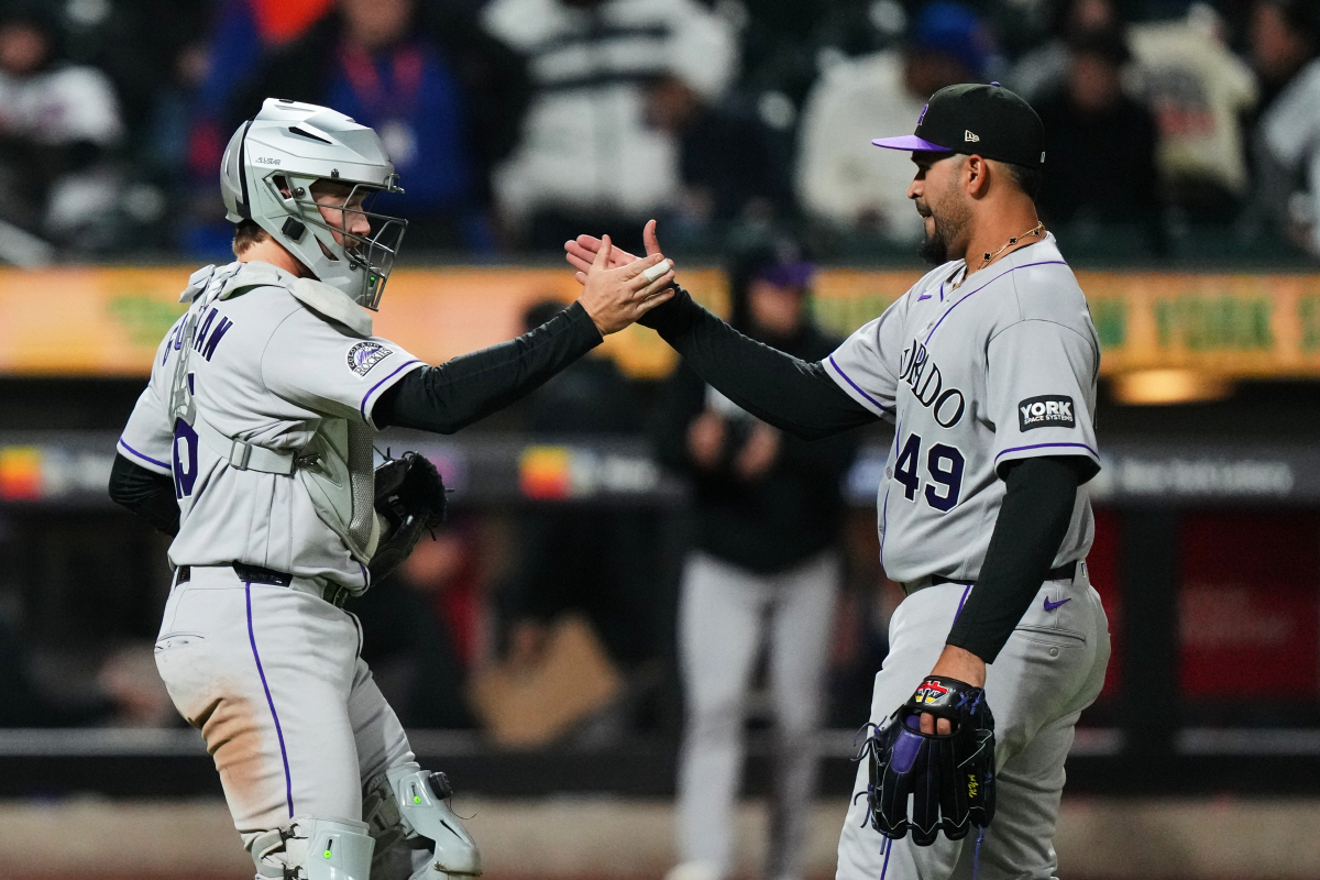 Colorado Rockies pitcher Antonio Senzatela, right, celebrates with catcher Hunter Goodman after a baseball game against the New York Mets Friday, April 24, 2026, in New York. (AP Photo/Frank Franklin II)