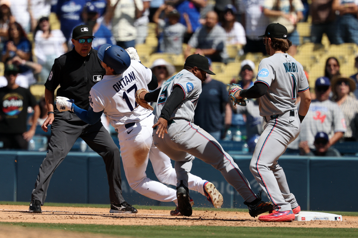 Apr 29, 2026; Los Angeles, California, USA; Miami Marlins second baseman Xavier Edwards (9) tagged Los Angeles Dodgers designated hitter Shohei Ohtani (17) out and steps on the first base to complete a game-ending double play in the ninth inning at Dodger Stadium. Mandatory Credit: Kiyoshi Mio-Imagn Images