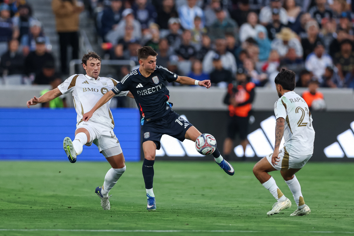 May 2, 2026; San Diego, California, USA; San Diego FC midfielder David Vazquez (19) moves the ball between Los Angeles Football Club defenders during the first half at Snapdragon Stadium. Mandatory Credit: Chadd Cady-Imagn Images