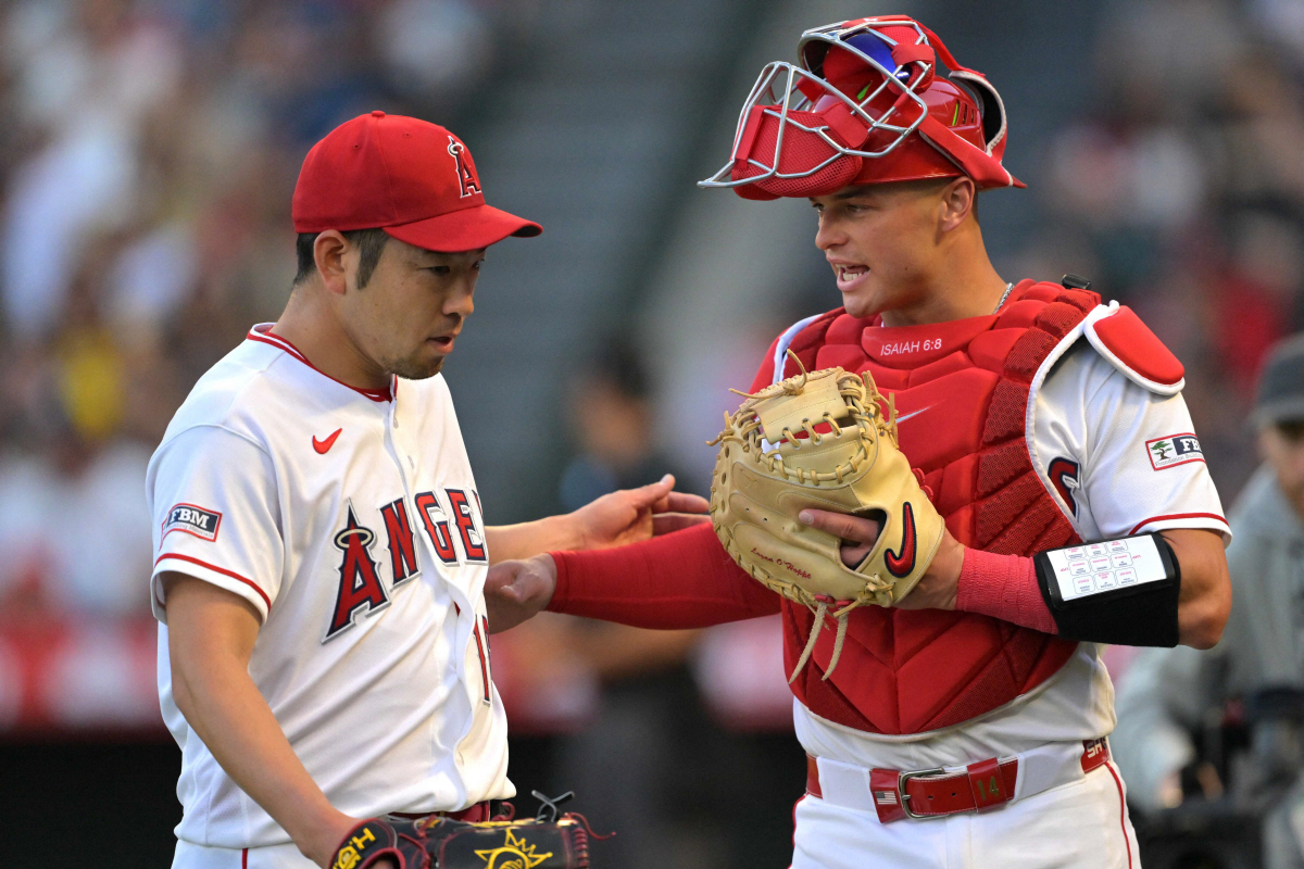 ANAHEIM, CALIFORNIA - APRIL 18: Yusei Kikuchi #16 of the Los Angeles Angels talks with Logan O'Hoppe #14 after the first inning against the San Diego Padres at Angel Stadium of Anaheim on April 18, 2026 in Anaheim, California. Jayne Kamin-Oncea/Getty Images/AFP (Photo by Jayne Kamin-Oncea / GETTY IMAGES NORTH AMERICA / Getty Images via AFP)