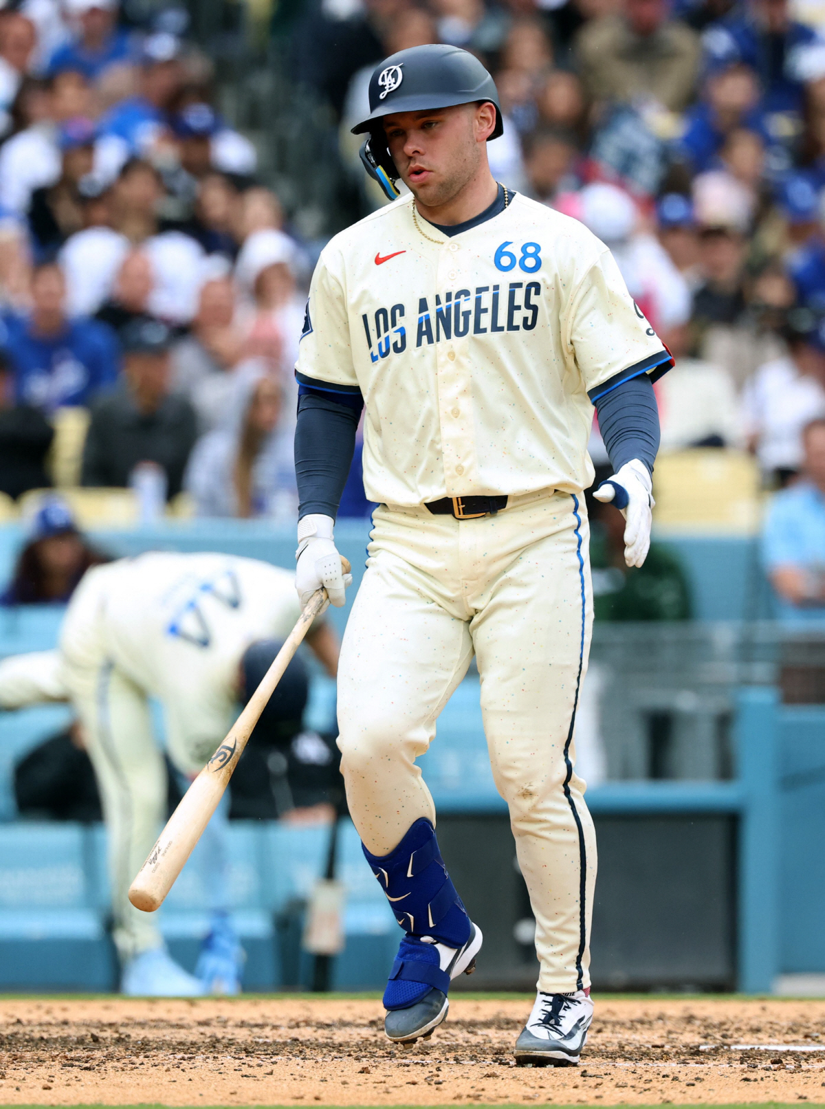 LOS ANGELES, CALIFORNIA - APRIL 25: Dalton Rushing #68 of the Los Angeles Dodgers reacts after fouling off a ball on his foot during the fourth inning against the Chicago Cubs at Dodger Stadium on April 25, 2026 in Los Angeles, California. Harry How/Getty Images/AFP (Photo by Harry How / GETTY IMAGES NORTH AMERICA / Getty Images via AFP)