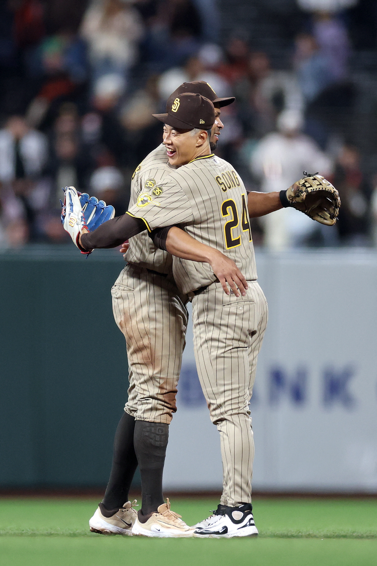 SAN FRANCISCO, CALIFORNIA - MAY 05: Sung-Mun Song #24 of the San Diego Padres hugs Xander Bogaerts #2 after they beat the San Francisco Giants at Oracle Park on May 05, 2026 in San Francisco, California. Ezra Shaw/Getty Images/AFP (Photo by EZRA SHAW / GETTY IMAGES NORTH AMERICA / Getty Images via AFP)