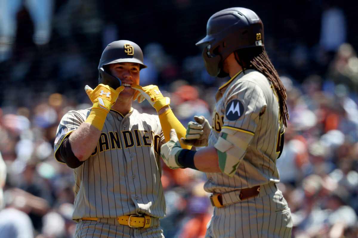 San Diego Padres' Gavin Sheets, left, celebrates with Fernando Tatis Jr., right, after hitting a home run against the San Francisco Giants during the fourth inning of a baseball game in San Francisco, Wednesday, May 6, 2026. (AP Photo/Jed Jacobsohn)