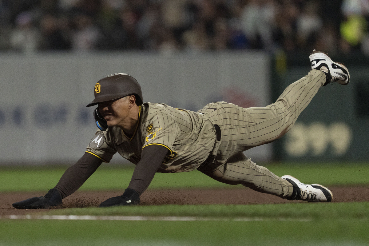 May 5, 2026; San Francisco, California, USA; San Diego Padres infielder Sung-Mun Song (24) slides into third base during the eighth inning against the San Francisco Giants at Oracle Park. Mandatory Credit: Stan Szeto-Imagn Images