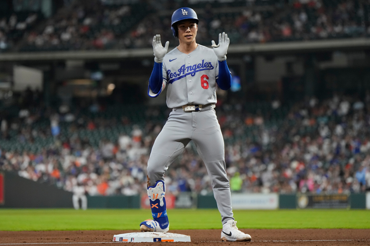 Los Angeles Dodgers' Hyeseong Kim celebrates a triple during the seventh inning of a baseball game against the Houston Astros in Houston, Wednesday, May 6, 2026. (AP Photo/Ashley Landis)