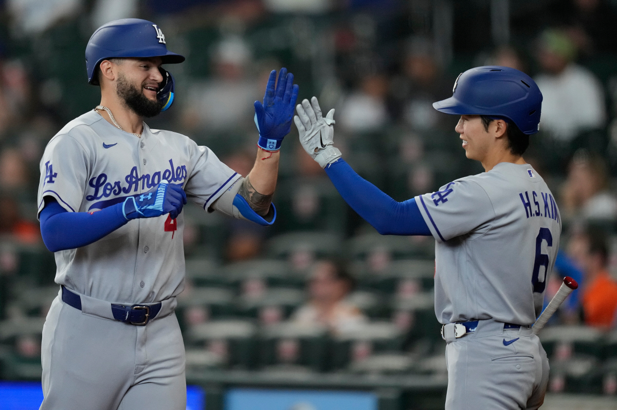 Los Angeles Dodgers' Andy Pages (44) celebrates with Hyeseong Kim (6) after a home run during the ninth inning of a baseball game against the Houston Astros in Houston, Wednesday, May 6, 2026. (AP Photo/Ashley Landis)