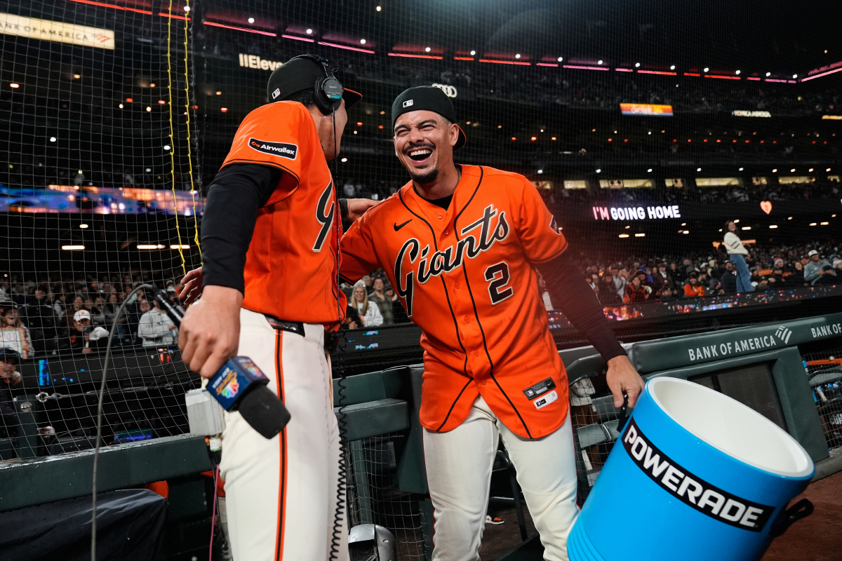 San Francisco Giants' Jung Hoo Lee, left, is hugged by shortstop Willy Adames (2) after the team's victory over the Pittsburgh Pirates in a baseball game Friday, May 8, 2026, in San Francisco. (AP Photo/Godofredo A. Vasquez)