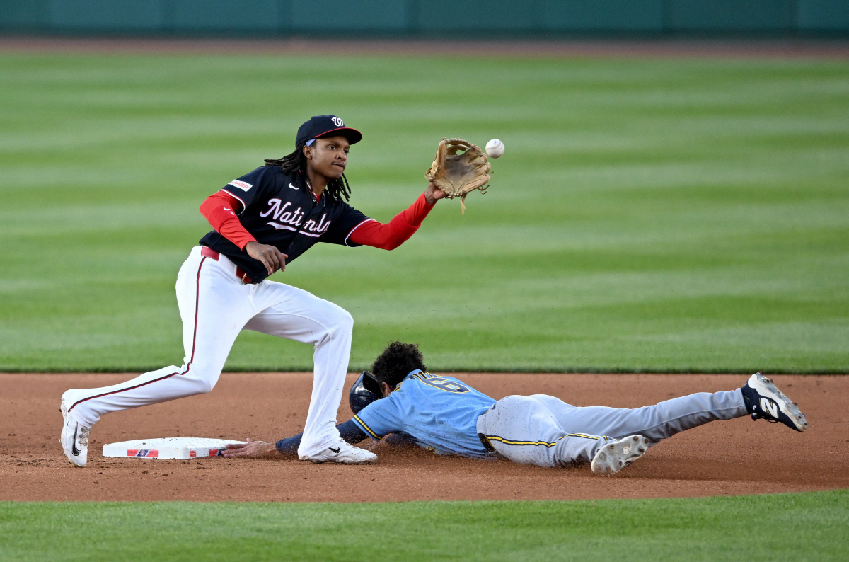 WASHINGTON, DC - MAY 01: David Hamilton #6 of the Milwaukee Brewers steals second base in the third inning ahead of the throw to CJ Abrams #5 of the Washington Nationals at Nationals Park on May 01, 2026 in Washington, DC. Greg Fiume/Getty Images/AFP (Photo by Greg Fiume / GETTY IMAGES NORTH AMERICA / Getty Images via AFP)