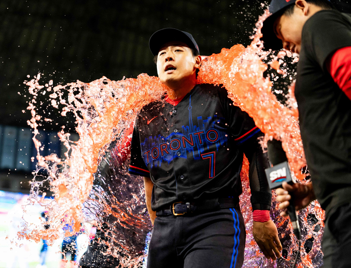 TORONTO, CANADA - MAY 8: Third baseman Kazuma Okamoto #7 of the Toronto Blue Jays gets doused in Body Armour after defeating the Los Angeles Angels at Rogers Centre on May 8, 2026 in Toronto, Canada. Kevin Sousa/Getty Images/AFP (Photo by Kevin Sousa / GETTY IMAGES NORTH AMERICA / Getty Images via AFP)