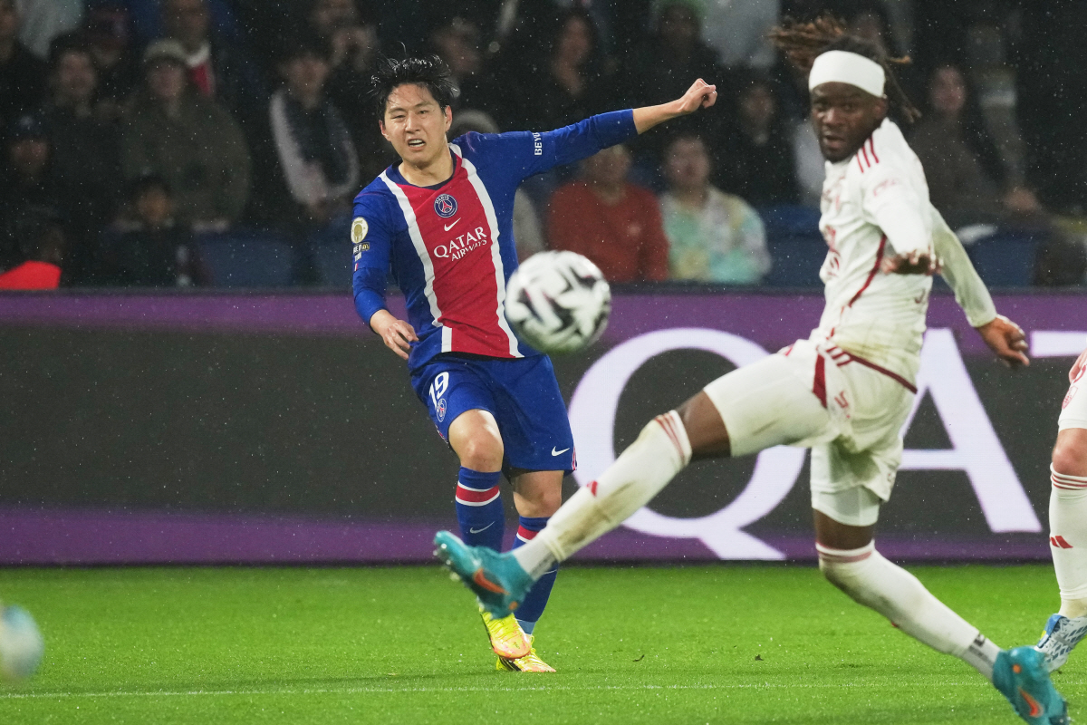 PSG's Lee Kang-in, right, attempts a shot on goal during the French League One soccer match between Paris Saint Germain and Brest in Paris, France, Sunday, May 10, 2026. (AP Photo/Thibault Camus)