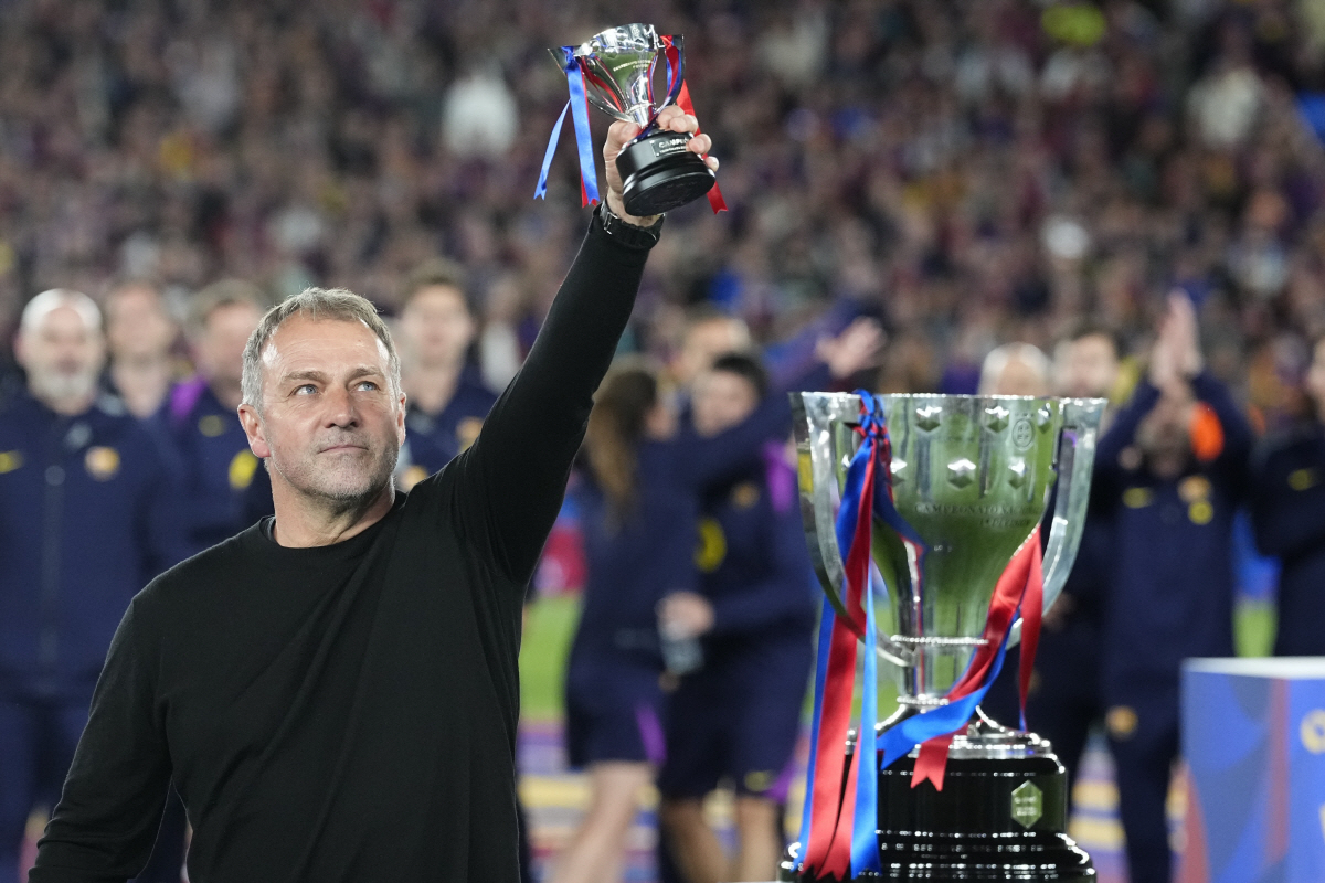 epaselect epa12946460 FC Barcelona's head coach Hansi Flick celebrates next to the trophy (R) of the 2025/2026 Spanish LaLiga Championship after winning the Spanish LaLiga soccer match between FC Barcelona and Real Madrid, in Barcelona, Spain, 10 May 2026. EPA/ENRIC FONTCUBERTA
