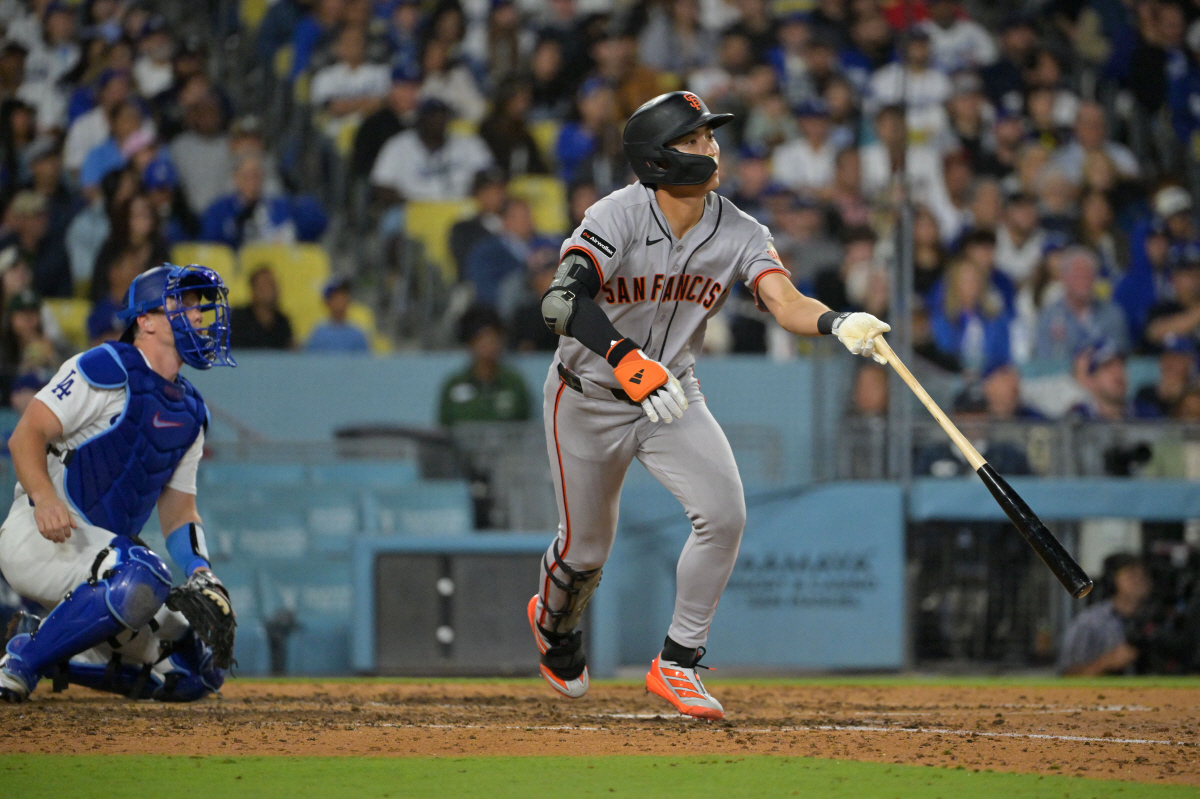 May 12, 2026; Los Angeles, California, USA; San Francisco Giants right fielder Jung Hoo Lee (51) watches the ball and runs after hitting a two run RBI double next to Los Angeles Dodgers catcher Will Smith (16) during the seventh inning at Dodger Stadium. Mandatory Credit: Jayne Kamin-Oncea-Imagn Images