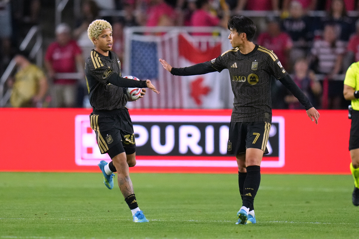 Los Angeles FC's David Martinez (30) is congratulated by teammate Son Heung-Min (7) after scoring during the second half of an MLS soccer match against St. Louis City Wednesday, May 13, 2026, in St. Louis. (AP Photo/Jeff Roberson)