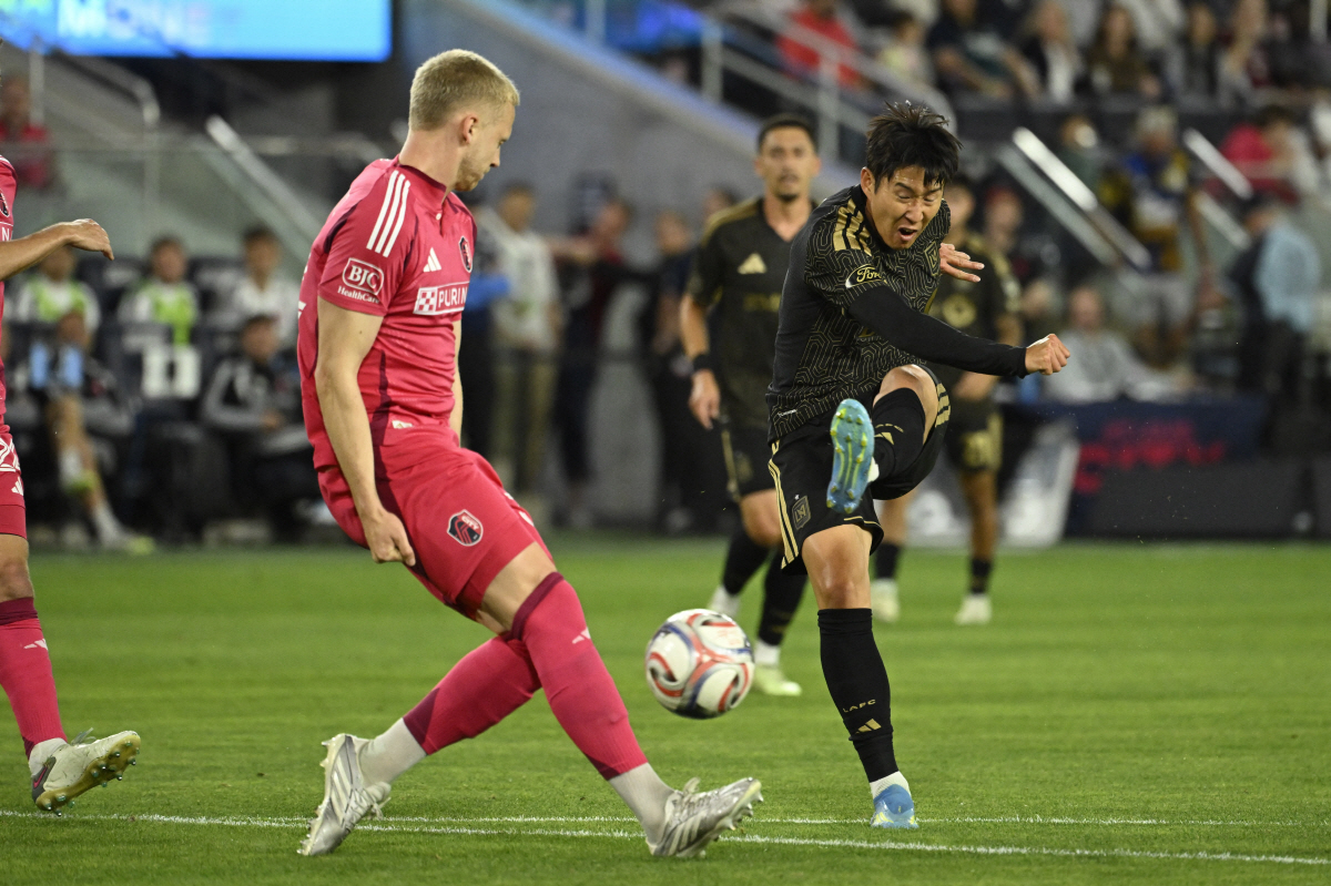 May 13, 2026; St. Louis, Missouri, USA; Los Angeles Football Club forward Son Heung-Min (7) kicks the ball against St. Louis CITY SC defender Timo Baumgartl (32) in the first half at Energizer Park. Mandatory Credit: Joe Puetz-Imagn Images