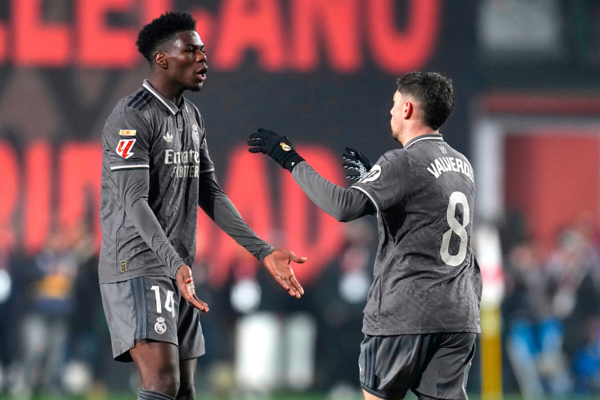 FILE - Real Madrid's Federico Valverde, right, celebrates with Aurelien Tchouameni after scoring his side's opening goal during the Spanish La Liga soccer match between Rayo Vallecano and Real Madrid at the Vallecas stadium in Madrid, Spain, Saturday, Dec. 14, 2024. (AP Photo/Manu Fernandez, File) FILE PHOTO