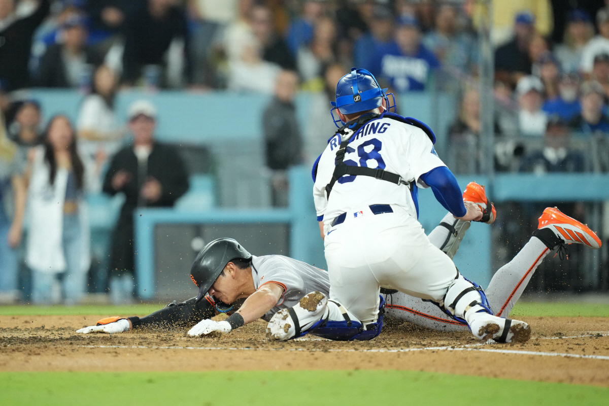 May 14, 2026; Los Angeles, California, USA; San Francisco Giants right fielder Jung Hoo Lee (51) slides home to score after hitting a two run home run against the Los Angeles Dodgers in the fifth inning at Dodger Stadium. Mandatory Credit: Kirby Lee-Imagn Images