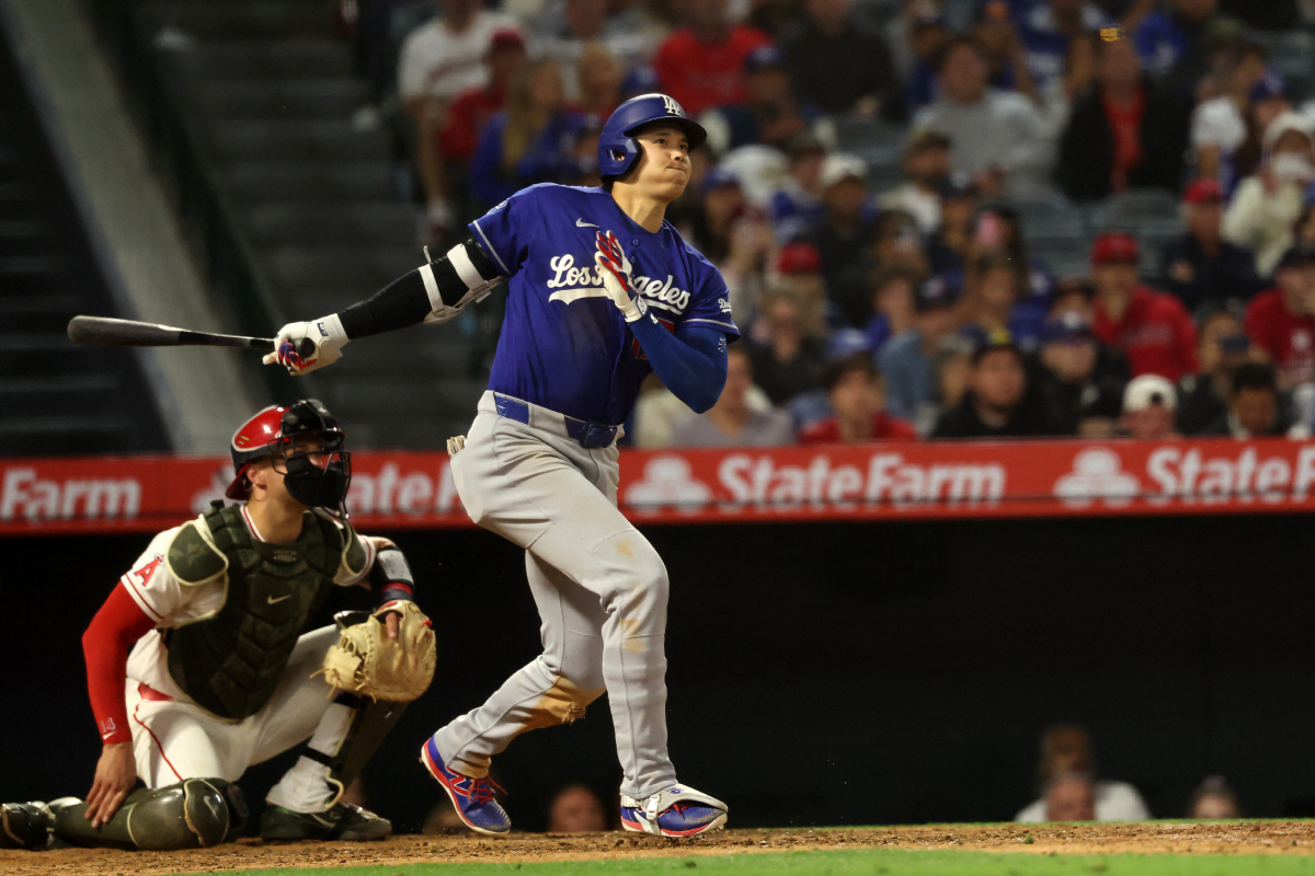 May 16, 2026; Anaheim, California, USA; Los Angeles Dodgers two-way player Shohei Ohtani (17) hits an RBI triple during the eighth inning against the Los Angeles Angels at Angel Stadium. Mandatory Credit: Kiyoshi Mio-Imagn Images