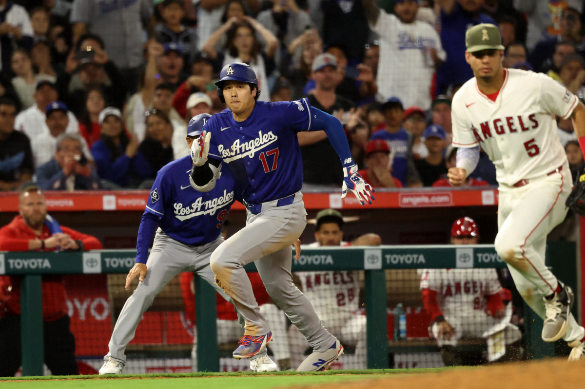 May 16, 2026; Anaheim, California, USA; Los Angeles Dodgers two-way player Shohei Ohtani (17) runs to home base on throwing error by Los Angeles Angels right fielder Jo Adell (not pictured) during the eighth inning against the Los Angeles Angels at Angel Stadium. Mandatory Credit: Kiyoshi Mio-Imagn Images