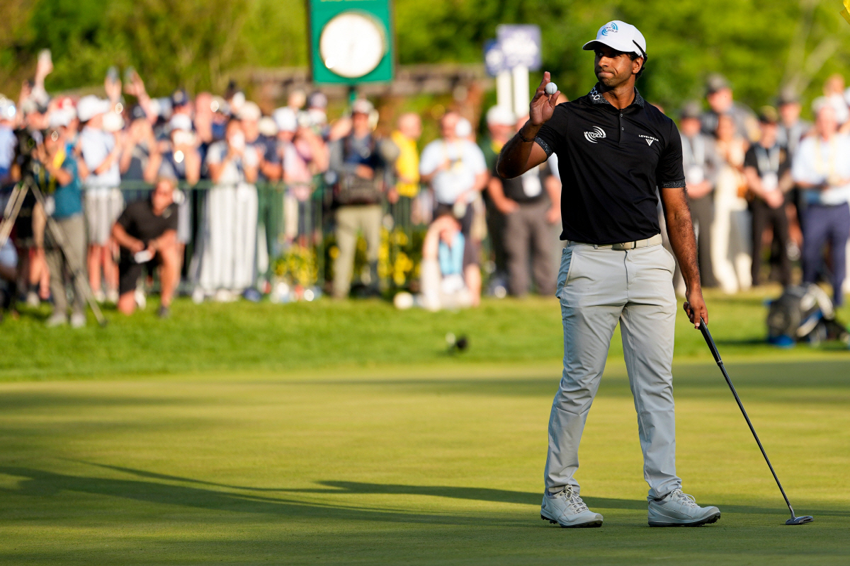 Aaron Rai, of England, waves after his round on the 18th green during the final round of the PGA Championship golf tournament at Aronimink Golf Club, Sunday, May 17, 2026, in Newtown Square, PA. (AP Photo/Carolyn Kaster)