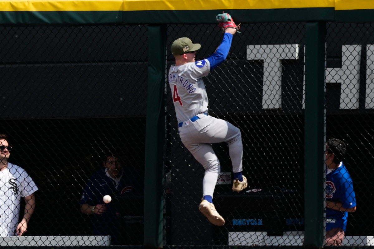 Chicago Cubs center fielder Pete Crow-Armstrong, center, cannot catch a two-run double hit by Chicago White Sox's Miguel Vargas during the fifth inning of a baseball game in Chicago, Sunday, May 17, 2026. (AP Photo/Nam Y. Huh)