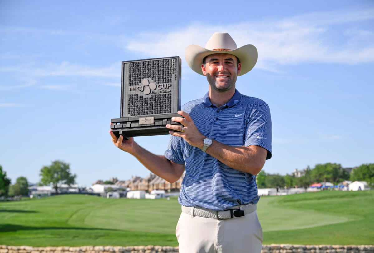 MCKINNEY, TEXAS - MAY 04: Scottie Scheffler of the United States poses with the winner's trophy after the final round of THE CJ CUP Byron Nelson 2025 at TPC Craig Ranch on May 04, 2025 in McKinney, Texas. (Photo by Orlando Ramirez/Getty Images for The CJ Cup)