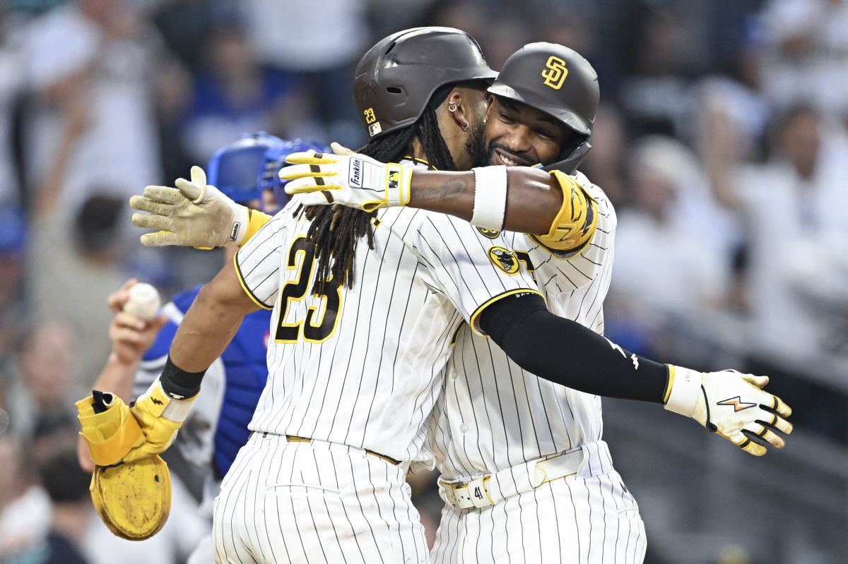 May 19, 2026; San Diego, California, USA; San Diego Padres designated hitter Miguel Andujar (41) is congratulated by second baseman Fernando Tatis Jr. (23) after hitting a two-run home run during the third inning against the Los Angeles Dodgers at Petco Park. Mandatory Credit: Denis Poroy-Imagn Images