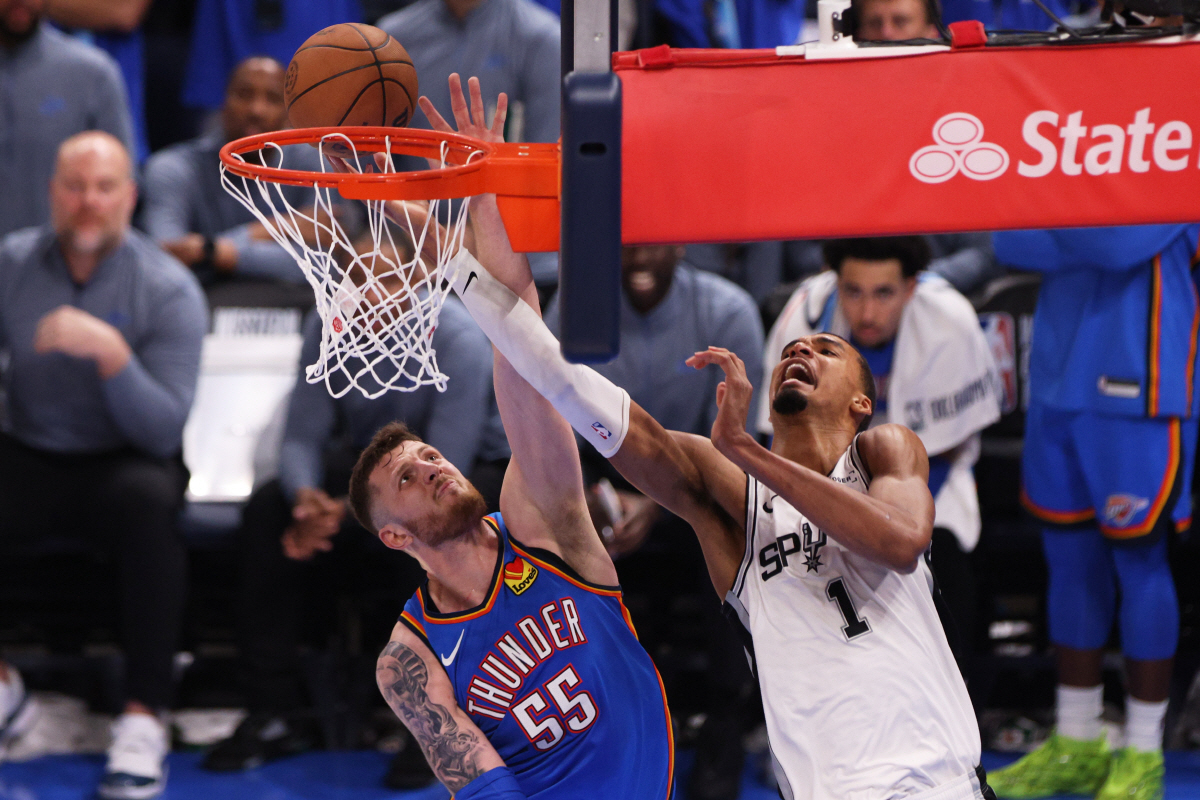 San Antonio Spurs forward Victor Wembanyama (1) shoots against Oklahoma City Thunder center Isaiah Hartenstein (55) during the second half of Game 2 in the Western Conference finals NBA basketball playoffs series Wednesday, May 20, 2026, in Oklahoma City. (AP Photo/Nate Billings)