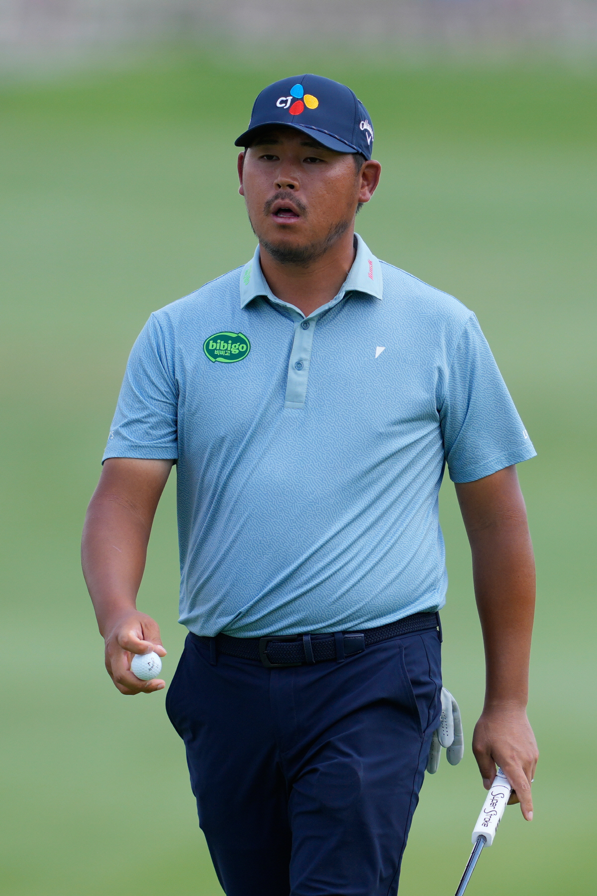 Si Wook Kim, of South Korea, walks off the 10th hole during the final round of the CJ Cup Byron Nelson golf tournament in McKinney, Texas, Sunday, May 24, 2026. (AP Photo/Tony Gutierrez)