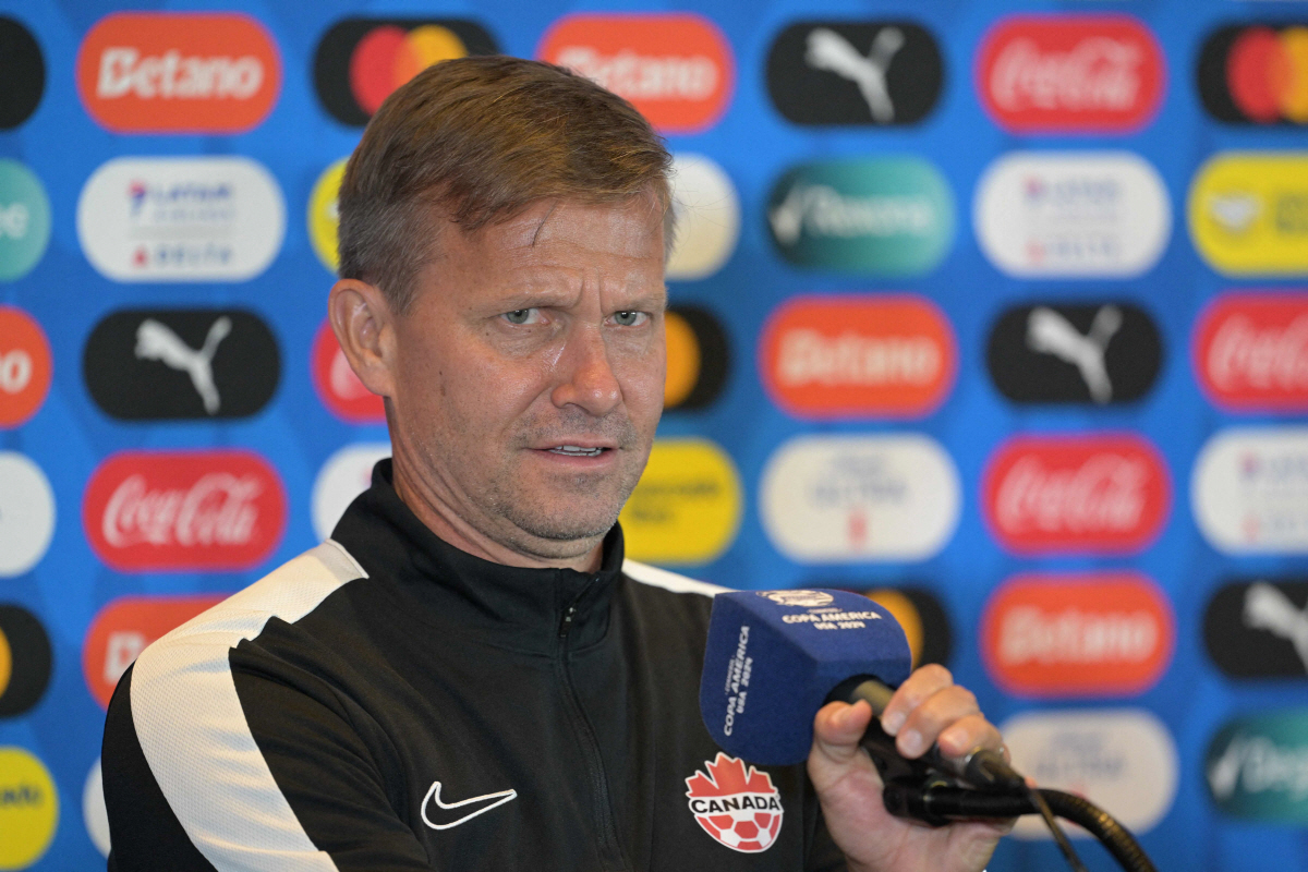 (FILES) Canada's US coach Jesse Marsch speaks during a press conference one day before the Conmebol 2024 Copa America tournament semifinal match between Canada and Argentina at MetLife Stadium in East Rutherford, New Jersey, on July 8, 2024. Exactly 150 years after the Carlton Cricket Club and the Toronto Lacrosse Club played the first recorded organized soccer match in Canada, in 1876, Canadian soccer is finally preparing to make its World Cup debut as host. (Photo by JUAN MABROMATA / AFP)