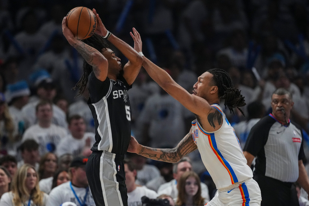 San Antonio Spurs guard Stephon Castle (5) drives on Oklahoma City Thunder forward Jaylin Williams (6) in the first half of Game 5 in the Western Conference finals NBA basketball playoffs series, Tuesday, May 26, 2026, in Oklahoma City. (AP Photo/Julio Cortez)