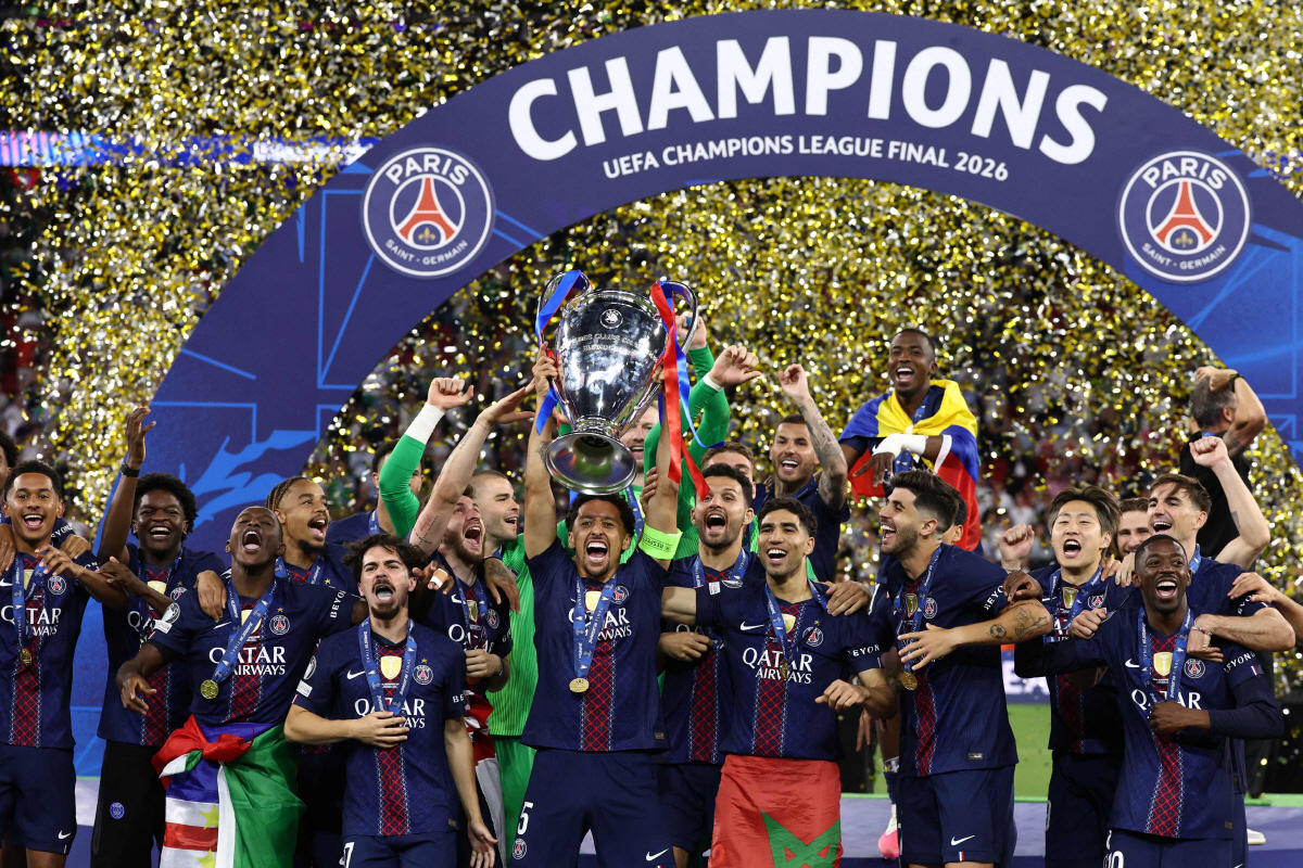 Paris Saint-Germain's Brazilian defender #05 Marquinhos lifts the trophy as he celebrates with teammates winning the UEFA Champions League final football match between Paris Saint-Germain (PSG) and Arsenal FC at the Puskas Arena in Budapest on May 30, 2026. (Photo by FRANCK FIFE / AFP)