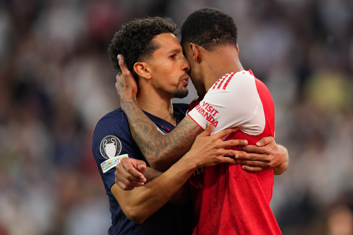 PSG's Marquinhos embraces Arsenal's Gabriel Magalhaes after the penalty shoot out