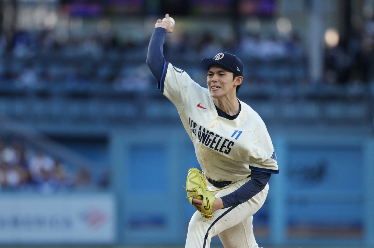 May 30, 2026; Los Angeles, California, USA; Los Angeles Dodgers starting pitcher Roki Sasaki (11) throws against the Philadelphia Phillies during the first inning at Dodger Stadium. Mandatory Credit: Kiyoshi Mio-Imagn Images