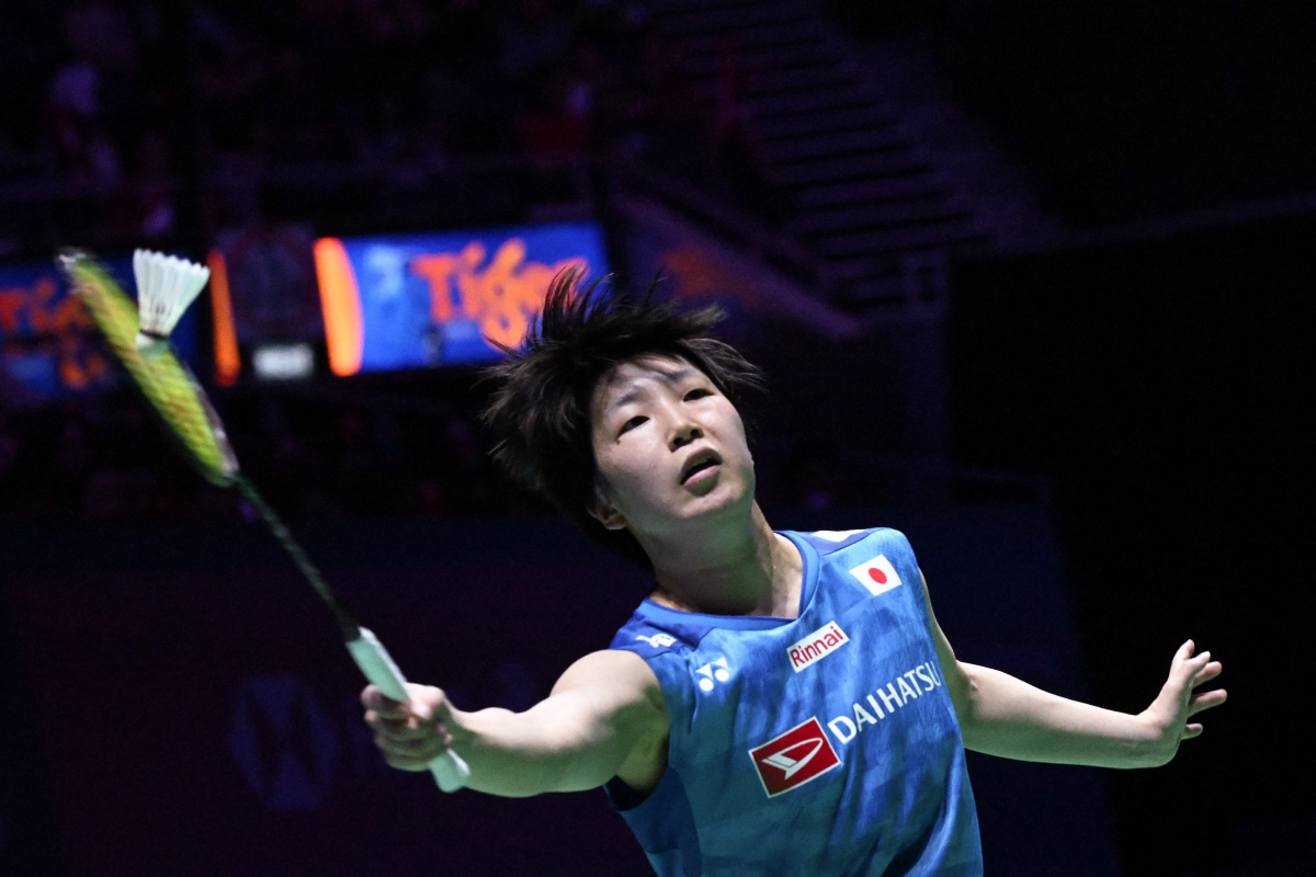 Akane Yamaguchi of Japan hits a return to An Se-young of South Korea in the women?s singles final match of the KFF Singapore Open Badminton tournament in Singapore on May 31, 2026. (Photo by Roslan RAHMAN / AFP)