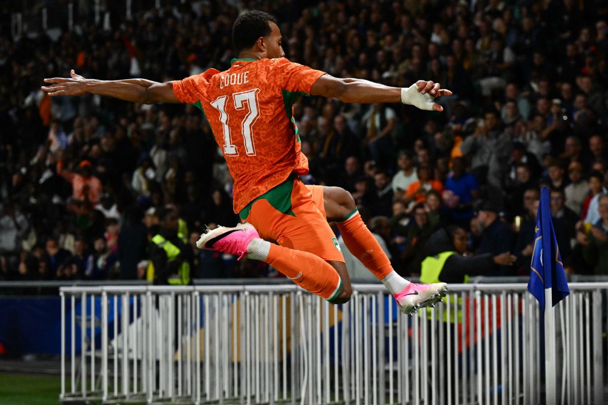 Ivory Coast's defender #17 Guela Doue celebrates scoring the equalizing goal